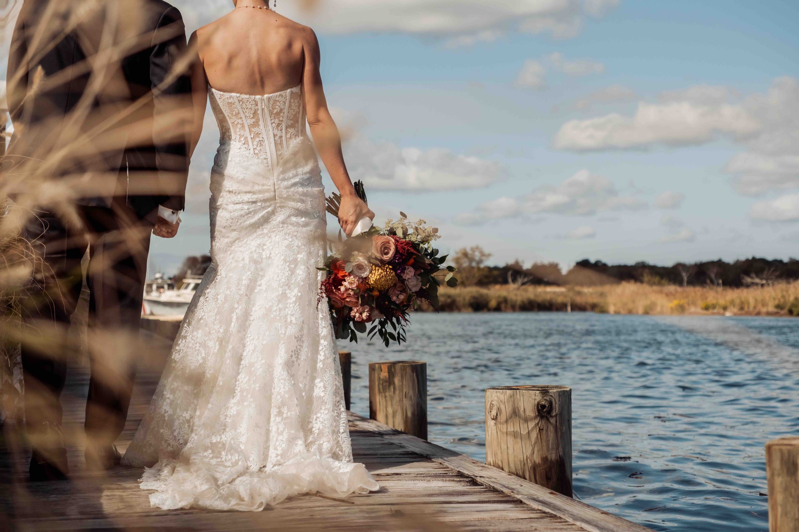 Bride and groom by the water